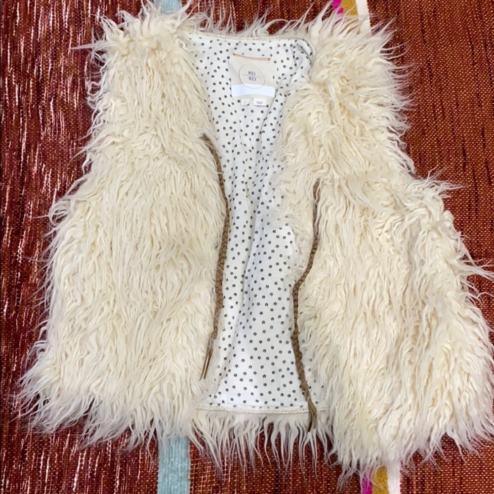 Anthro vest brand is Hei